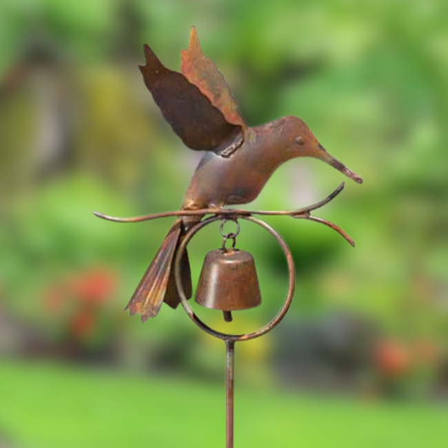 Close-up view of the Hummingbird Bell Garden Stake with a detailed hummingbird silhouette and a metal bell beneath, ready to chime in the wind.